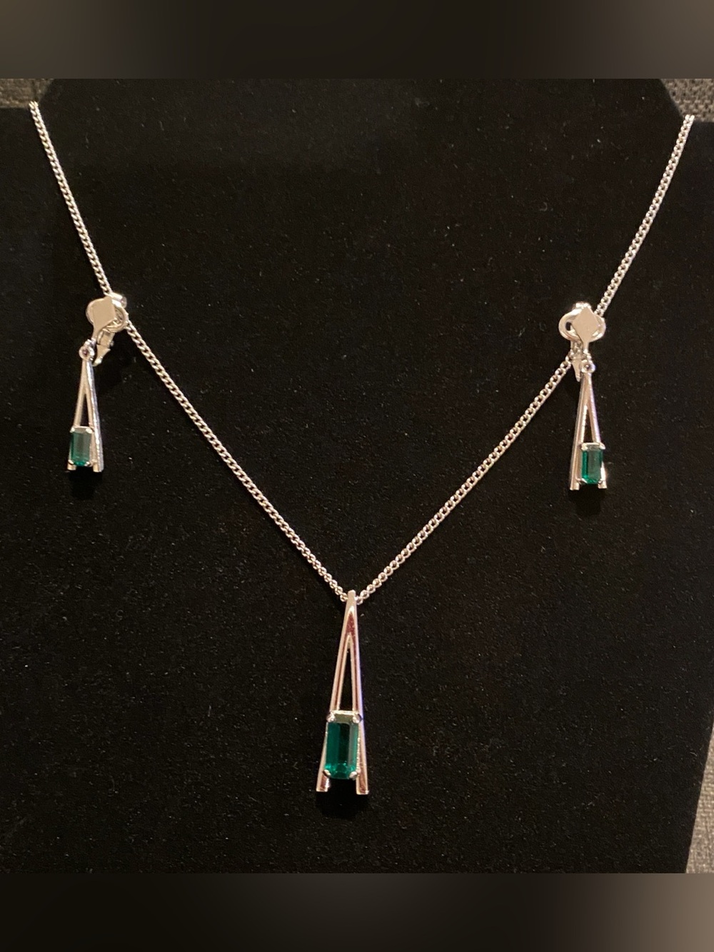 Avon Silver Necklace and Clip on Earrings Set with Emerald Green Stones. NWOT